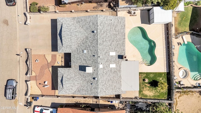 drone / aerial view of a pool