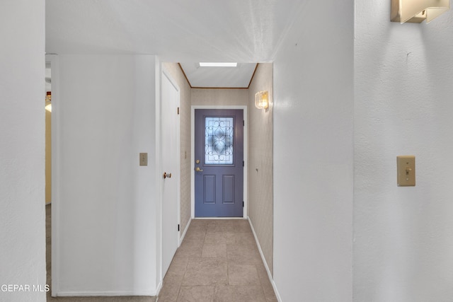 entryway featuring baseboards