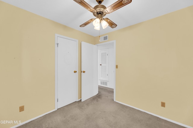 unfurnished bedroom with carpet flooring, baseboards, and ceiling fan