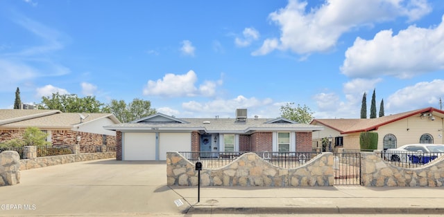 ranch-style home featuring brick siding, concrete driveway, and a garage