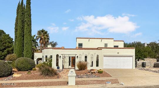 852 Cresta Alta Dr, El Paso, TX 79912 - mediterranean / spanish house with a garage, driveway, and stucco siding