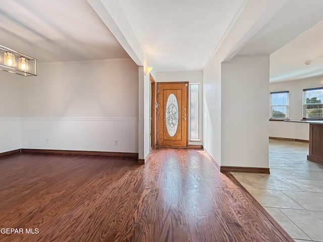 852 Cresta Alta Dr, El Paso, TX 79912 - entryway featuring wood finished floors, baseboards, and crown molding