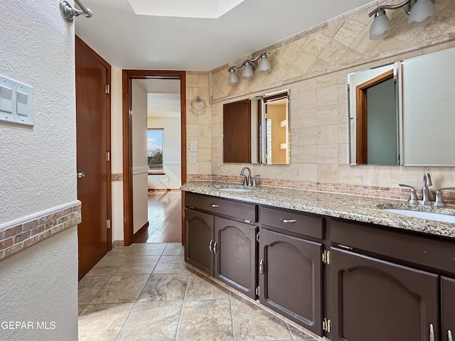 852 Cresta Alta Dr, El Paso, TX 79912 - bathroom with double vanity and a textured wall