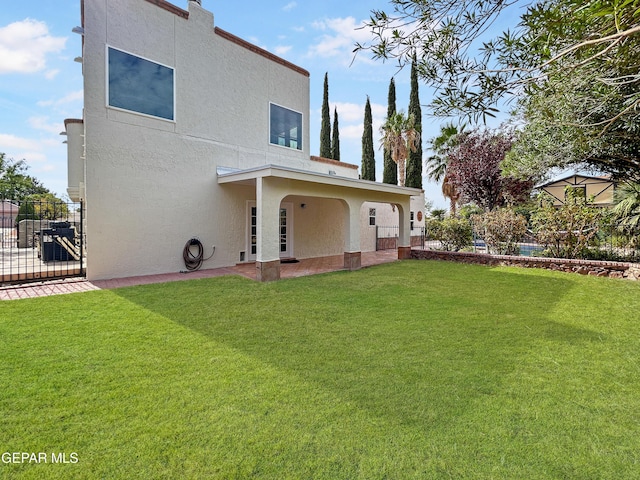 852 Cresta Alta Dr, El Paso, TX 79912 - rear view of house featuring stucco siding, a gate, and a patio