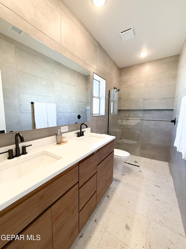 15101 Steer Dr, El Paso, TX 79938 - full bath featuring tile walls, toilet, walk in shower, and double vanity