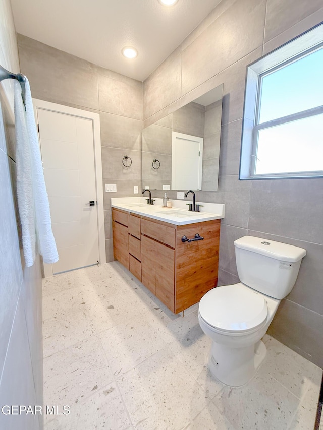15101 Steer Dr, El Paso, TX 79938 - full bath with tile walls, toilet, and double vanity