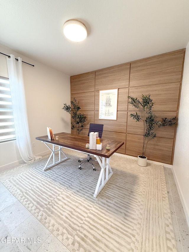 15101 Steer Dr, El Paso, TX 79938 - home office with baseboards, wood walls, and light tile patterned flooring