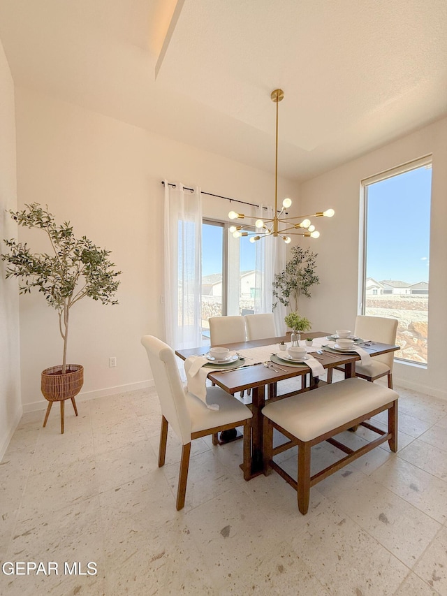 15101 Steer Dr, El Paso, TX 79938 - dining room featuring a chandelier, healthy amount of natural light, and baseboards