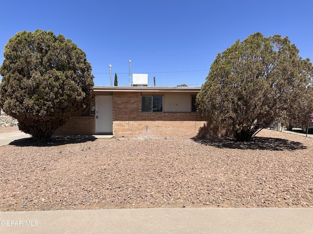 view of front of home with brick siding