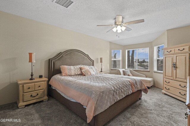 bedroom with carpet flooring, a textured ceiling, and ceiling fan