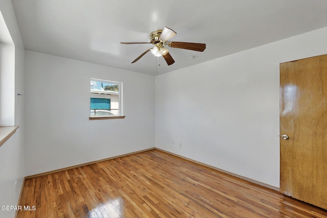 spare room featuring a ceiling fan and light wood-style flooring