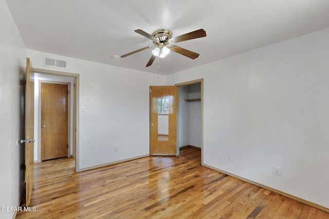 unfurnished bedroom with light wood-style floors, baseboards, and ceiling fan