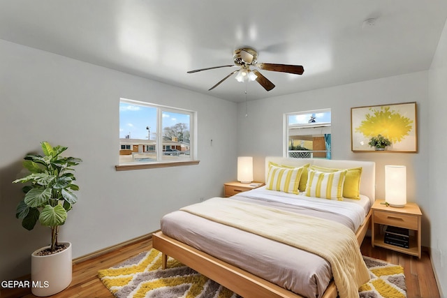 bedroom with wood finished floors and ceiling fan