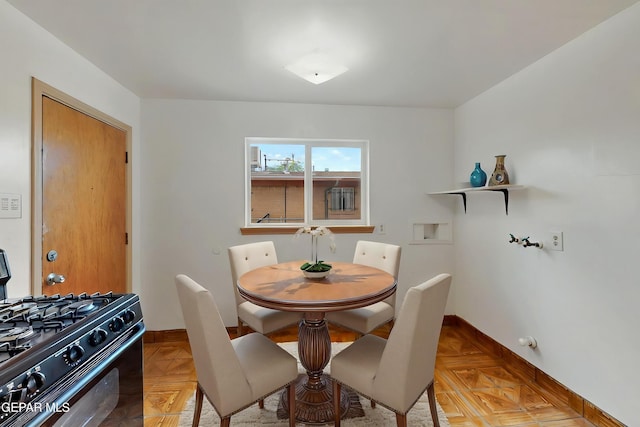 dining area featuring baseboards
