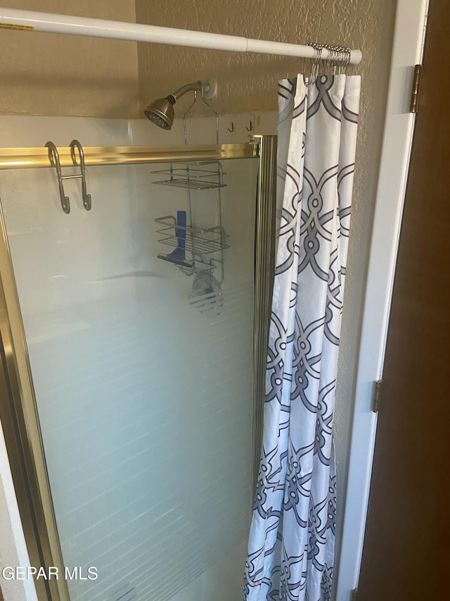 bathroom featuring curtained shower