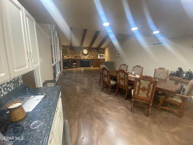 dining room with concrete flooring