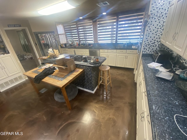 dining room featuring concrete flooring