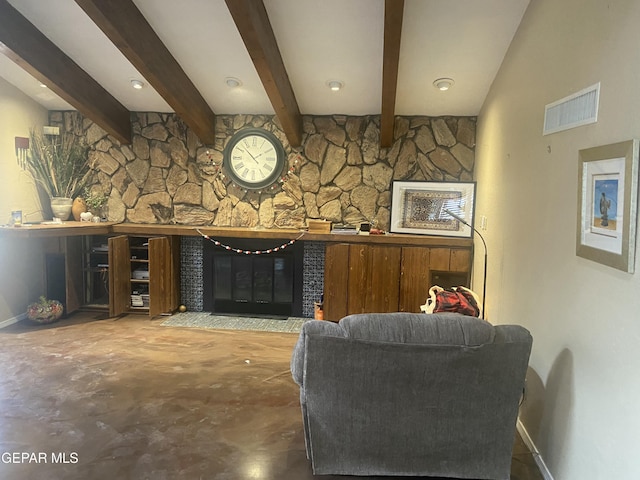living area with a glass covered fireplace, baseboards, concrete floors, and beamed ceiling