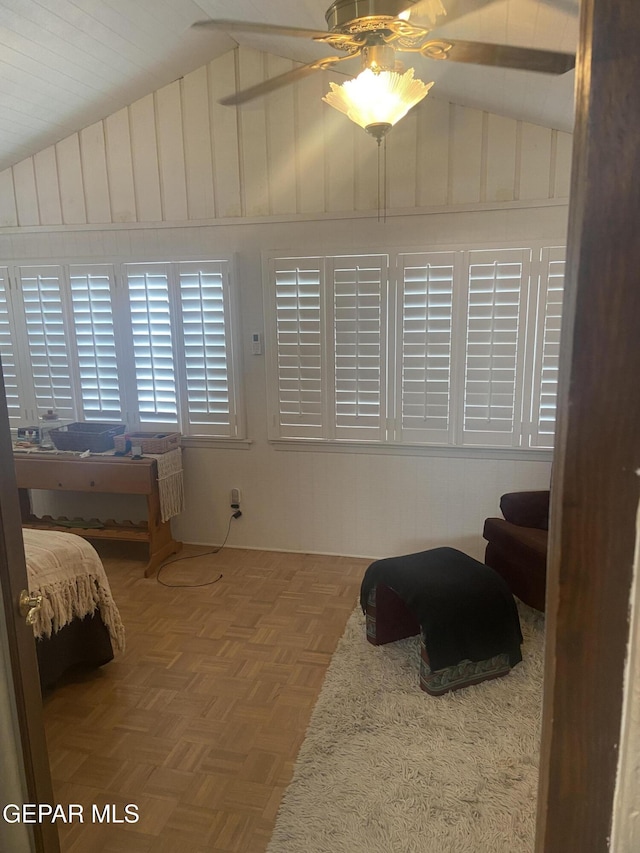 bedroom with lofted ceiling and a ceiling fan