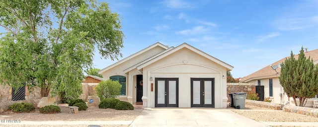 4729 Joseph Rodriguez Dr, El Paso, TX 79938 - single story home with french doors, stucco siding, and fence