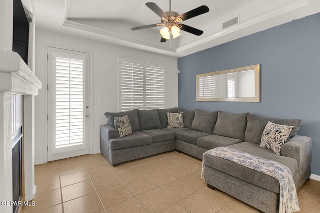4729 Joseph Rodriguez Dr, El Paso, TX 79938 - living area featuring a tray ceiling, a ceiling fan, and healthy amount of natural light