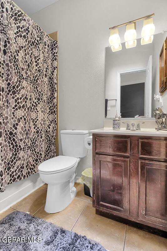 4729 Joseph Rodriguez Dr, El Paso, TX 79938 - bathroom featuring toilet, tile patterned flooring, and vanity