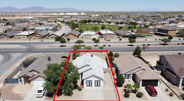 4729 Joseph Rodriguez Dr, El Paso, TX 79938 - aerial perspective of suburban area with a mountain backdrop and property parcel outlined