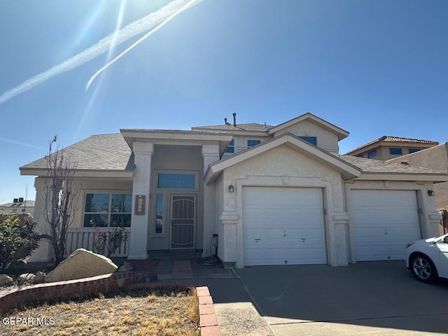 view of front of home with a garage, concrete driveway, stucco siding, and a shingled roof