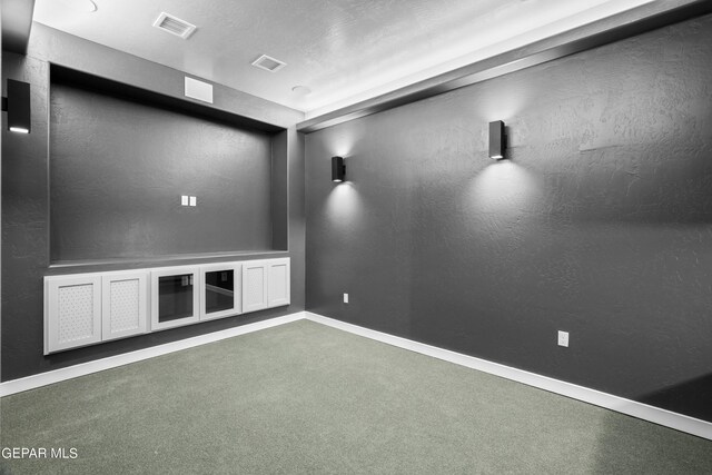 carpeted spare room with baseboards