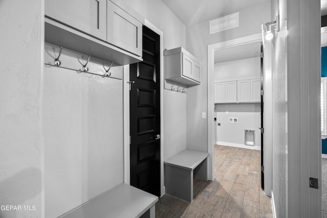 mudroom with wood finished floors