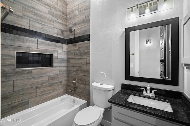 full bathroom featuring shower / bathtub combination, toilet, vanity, and a textured wall