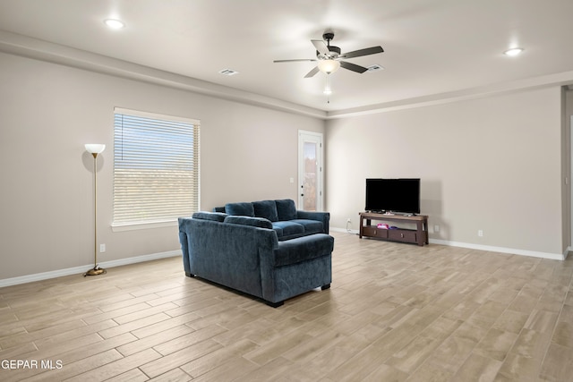 living area with ceiling fan, baseboards, light wood finished floors, and recessed lighting