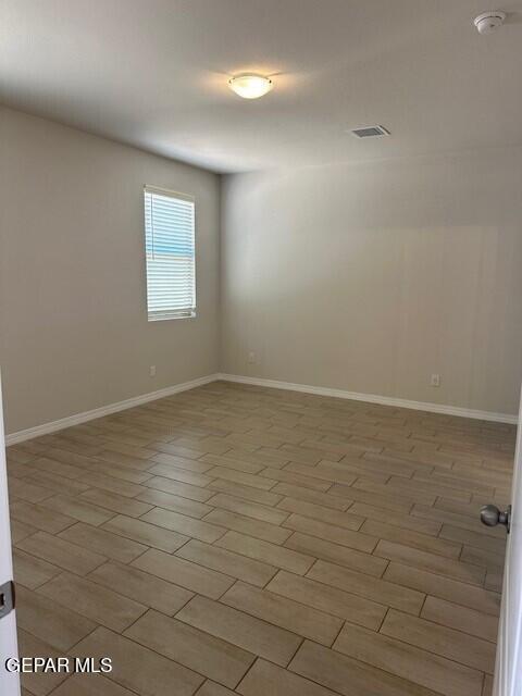 6112 Hidden Row Ave, El Paso, TX 79924 - empty room with a smoke detector and baseboards