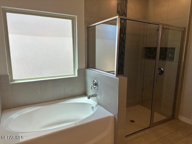 6112 Hidden Row Ave, El Paso, TX 79924 - bathroom featuring healthy amount of natural light and a shower stall