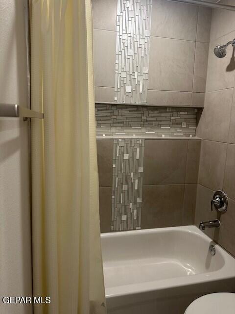 6112 Hidden Row Ave, El Paso, TX 79924 - full bath featuring shower / bath combo with shower curtain and toilet