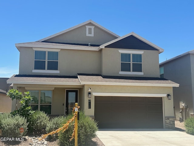 6112 Hidden Row Ave, El Paso, TX 79924 - view of front of home featuring an attached garage, stucco siding, and driveway
