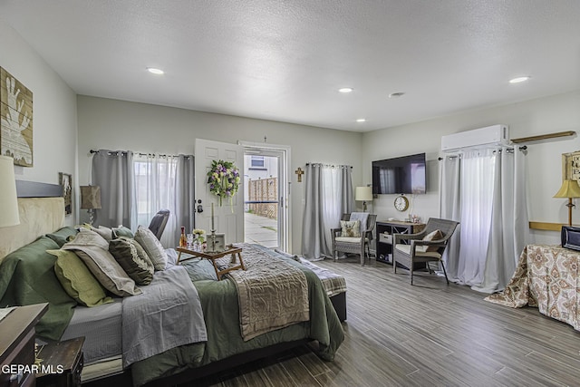 3244 Richmond Ave, El Paso, TX 79930 - bedroom with wood finished floors, an AC wall unit, recessed lighting, and access to exterior