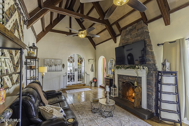 3244 Richmond Ave, El Paso, TX 79930 - living area with a ceiling fan, arched walkways, wood-type flooring, high vaulted ceiling, and beamed ceiling