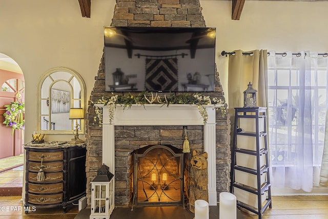 3244 Richmond Ave, El Paso, TX 79930 - detailed view of wood finished floors, a stone fireplace, and arched walkways