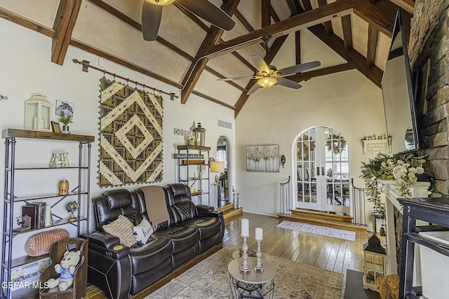 3244 Richmond Ave, El Paso, TX 79930 - living room with ceiling fan, arched walkways, beam ceiling, hardwood / wood-style flooring, and high vaulted ceiling