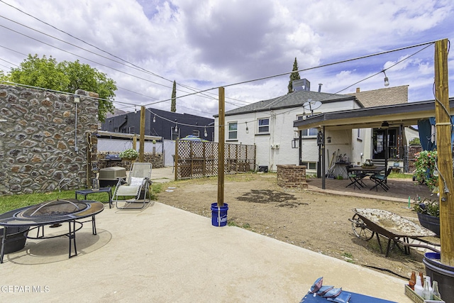 3244 Richmond Ave, El Paso, TX 79930 - view of patio featuring a fire pit and fence
