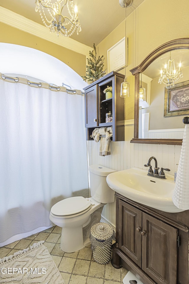3244 Richmond Ave, El Paso, TX 79930 - full bath with a chandelier, vanity, toilet, and crown molding