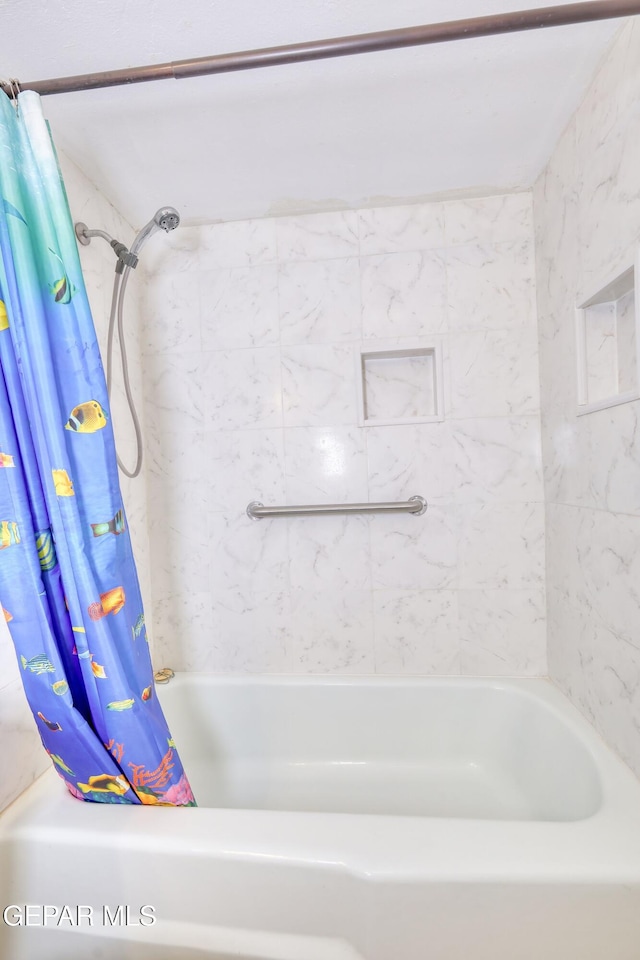 full bath with a bathtub and a shower with shower curtain
