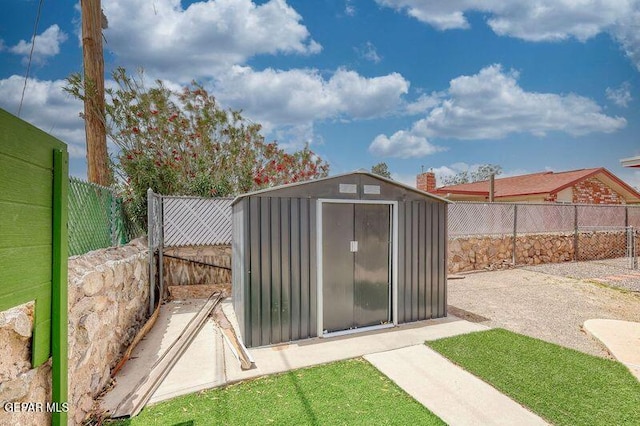 view of shed with a fenced backyard