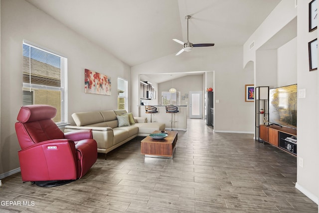 7421 Dewberry Dr, El Paso, TX 79911 - living area featuring a ceiling fan, wood finished floors, baseboards, and high vaulted ceiling