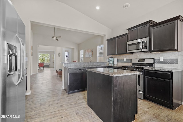 7421 Dewberry Dr, El Paso, TX 79911 - kitchen featuring stainless steel appliances, vaulted ceiling, a sink, a peninsula, and ceiling fan