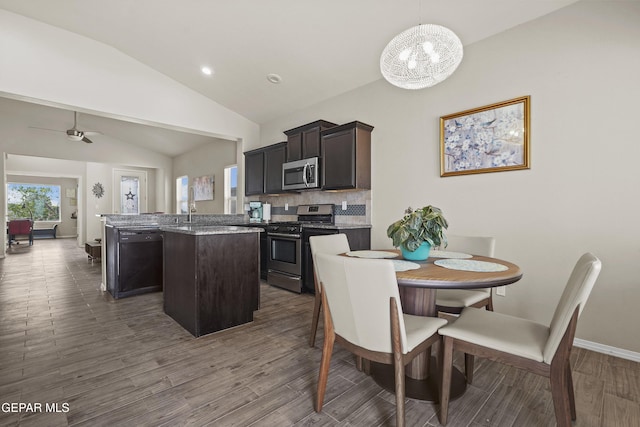 7421 Dewberry Dr, El Paso, TX 79911 - dining space with lofted ceiling, dark wood-type flooring, a chandelier, baseboards, and recessed lighting