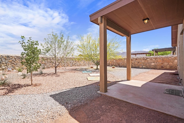 7421 Dewberry Dr, El Paso, TX 79911 - fenced backyard with a patio area