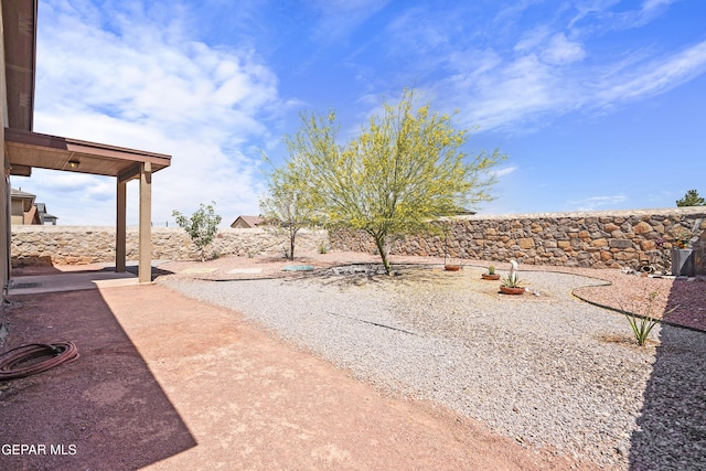 7421 Dewberry Dr, El Paso, TX 79911 - fenced backyard featuring a patio area