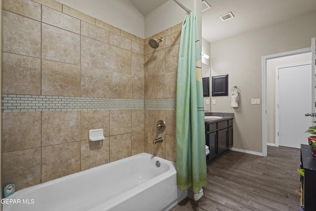 7421 Dewberry Dr, El Paso, TX 79911 - full bathroom with shower / tub combo with curtain, wood finished floors, vanity, and baseboards
